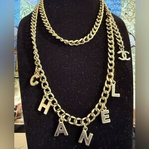 CHANEL Gold Necklace with Logo Charms